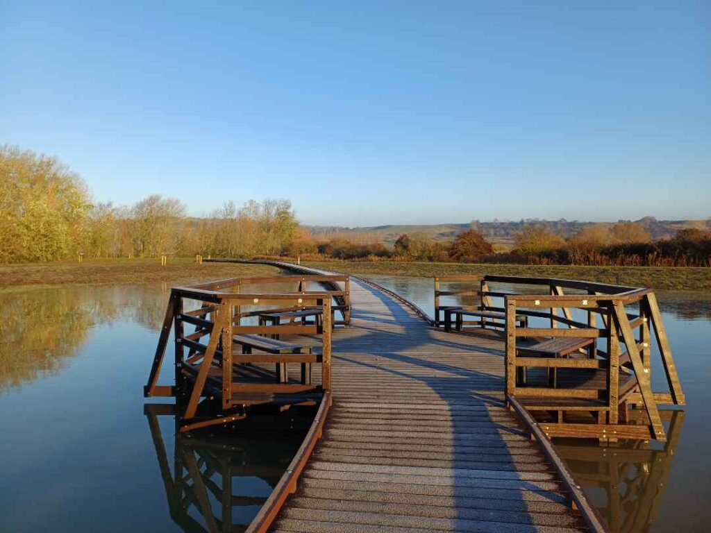 Boardwalk installation at Martello Lakes, still water and clear blue skies